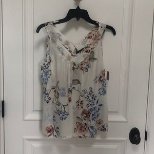 100% Silk V-neck top.